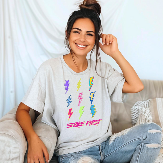 Strike First Lightning Bolt Grid Tee – Retro 90s Bold Thunder Aesthetic Shirt